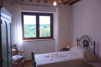 Łóżko lub łóżka w pokoju w obiekcie Agriturismo Podere Il Sorbo