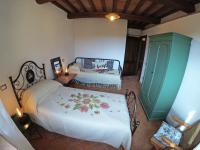 Łóżko lub łóżka w pokoju w obiekcie Agriturismo Podere Il Sorbo