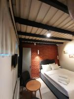 A bed or beds in a room at Taxim No18 Boutique Hotel