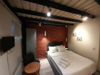 A bed or beds in a room at Taxim No18 Boutique Hotel