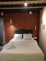 A bed or beds in a room at Taxim No18 Boutique Hotel