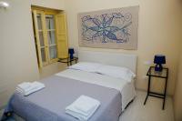 Posteľ alebo postele v izbe v ubytovaní Calamarina Centro
