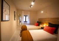 Posteľ alebo postele v izbe v ubytovaní Apartamentos UXAMA LUXURY EPONA - junto a la Plaza Mayor con ascensor