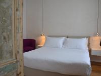 Posteľ alebo postele v izbe v ubytovaní Piazza Vittorio Suites