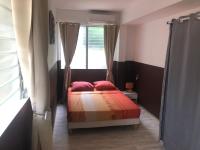 Кровать или кровати в номере Hibiscus