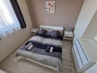 Postel nebo postele na pokoji v ubytování HIGH STREET APARTMAN