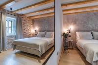 Postel nebo postele na pokoji v ubytování Amoretta rooms
