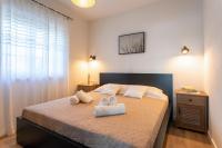 Posteľ alebo postele v izbe v ubytovaní HANA Luxury apartment with sea view