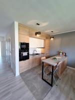 Kuchyňa alebo kuchynka v ubytovaní Domek pod świerkami - "Apartamenty świerkowe"