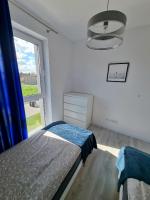 Posteľ alebo postele v izbe v ubytovaní Domek pod świerkami - "Apartamenty świerkowe"