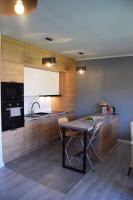 Kuchyňa alebo kuchynka v ubytovaní Domek pod świerkami - "Apartamenty świerkowe"