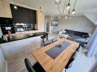 Kuchyňa alebo kuchynka v ubytovaní Domek pod świerkami - "Apartamenty świerkowe"