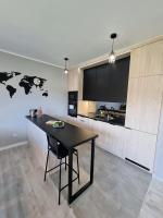 Kuchyňa alebo kuchynka v ubytovaní Domek pod świerkami - "Apartamenty świerkowe"