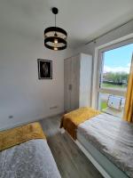 Posteľ alebo postele v izbe v ubytovaní Domek pod świerkami - "Apartamenty świerkowe"