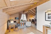 a living room with wooden walls and wooden ceilings at Grand Hotel Zermatterhof in Zermatt