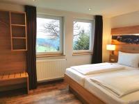 Postel nebo postele na pokoji v ubytování Hotel & Chalets Herrihof