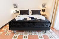 Posteľ alebo postele v izbe v ubytovaní Foresteria di Piazza Cavour - Luxury Suites & Guest House