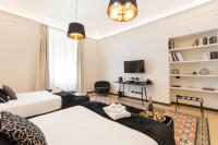 Posteľ alebo postele v izbe v ubytovaní Foresteria di Piazza Cavour - Luxury Suites & Guest House