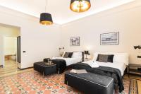 Posteľ alebo postele v izbe v ubytovaní Foresteria di Piazza Cavour - Luxury Suites & Guest House