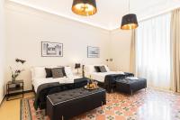Posteľ alebo postele v izbe v ubytovaní Foresteria di Piazza Cavour - Luxury Suites & Guest House