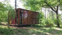 a wooden cabin in the middle of a forest at Agricampeggio Madonna di Pogi in Bucine