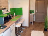 Kuchyňa alebo kuchynka v ubytovaní White Stone Apartman
