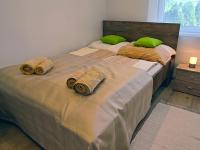 Posteľ alebo postele v izbe v ubytovaní White Stone Apartman
