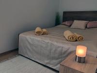 Posteľ alebo postele v izbe v ubytovaní White Stone Apartman