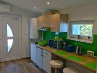 Kuchyňa alebo kuchynka v ubytovaní White Stone Apartman