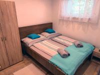 Posteľ alebo postele v izbe v ubytovaní White Stone Apartman