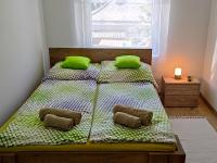 Posteľ alebo postele v izbe v ubytovaní White Stone Apartman