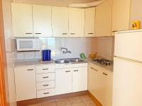 Kuchyň nebo kuchyňský kout v ubytování Apartamento Papa Luna Primera Línea 3000