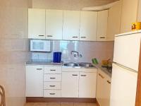 Kuchyň nebo kuchyňský kout v ubytování Apartamento Papa Luna Primera Línea 3000