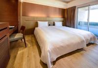 Talmud Hotel Tainanにあるベッド