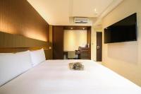 Talmud Hotel Tainanにあるベッド