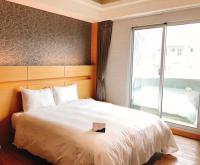 Talmud Hotel Tainanにあるベッド