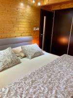 A bed or beds in a room at Grand Spa Holiday Home