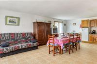 a living room with a table and a couch at Maison de 4 chambres avec jardin clos a Nevez a 1 km de la plage in Névez