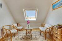 a room with chairs and a table and a window at Maison de 4 chambres avec jardin clos a Nevez a 1 km de la plage in Névez