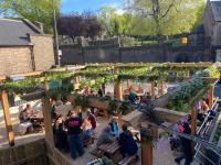 an overhead view of a garden with people sitting around at Kick Ass Greyfriars (18+) in Edinburgh