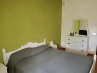 A bed or beds in a room at B&B La Scapola
