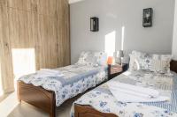 Posteľ alebo postele v izbe v ubytovaní Kamilari Paradise Luxury Villa