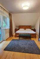 Llit o llits en una habitaci&oacute; de Ferienwohnung Eckberger Weinstrasse 139