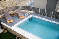 Bazén v ubytovaní Kamilari Paradise Luxury Villa alebo v jeho blízkosti