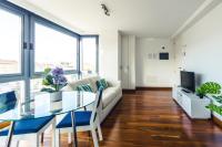 A television and/or entertainment centre at Melenara Beach Avenue Apt Shared Terrace