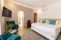 Posteľ alebo postele v izbe v ubytovaní M Mansion