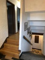 a hallway with a fireplace in a house at LA PETITE MESANGE in Dabo