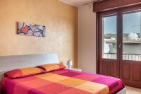 A bed or beds in a room at House&Villas - Mare Blu