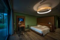 A bed or beds in a room at Villaverde Hotel Spa&Golf Udine