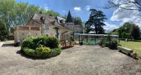 a large house with a garden in front of it at Château l&#39;Hubertière, classé du tourisme 4 étoiles in Bouresse